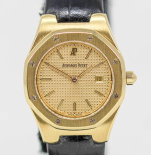 Ladies Audemars Piguet Royal Oak with Date Wristwatch in 18k Yellow Gold: 18k Yellow Gold Ladies Audemars Piguet Royal Oak with Date Wristwatch on Leather and 18k Yellow Gold Audemars Piguet Strap; Ref 66800BA, Serial # 568/D66539. 27mm diameter. Not running. PLEASE NOTE: