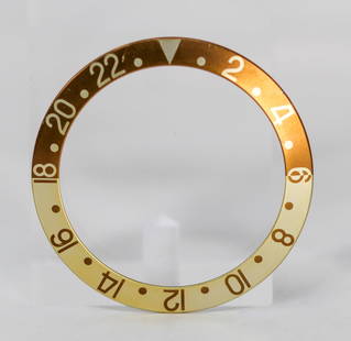 Loose Vintage Rolex GMT Bezel: Loose Vintage Rolex GMT Bezel. Brown and gold bezel. 38mm diameter. Loose watch parts. PLEASE NOTE: all wristwatches are sold "as-is", with no mechanical warranty or guarantee. Any representation as