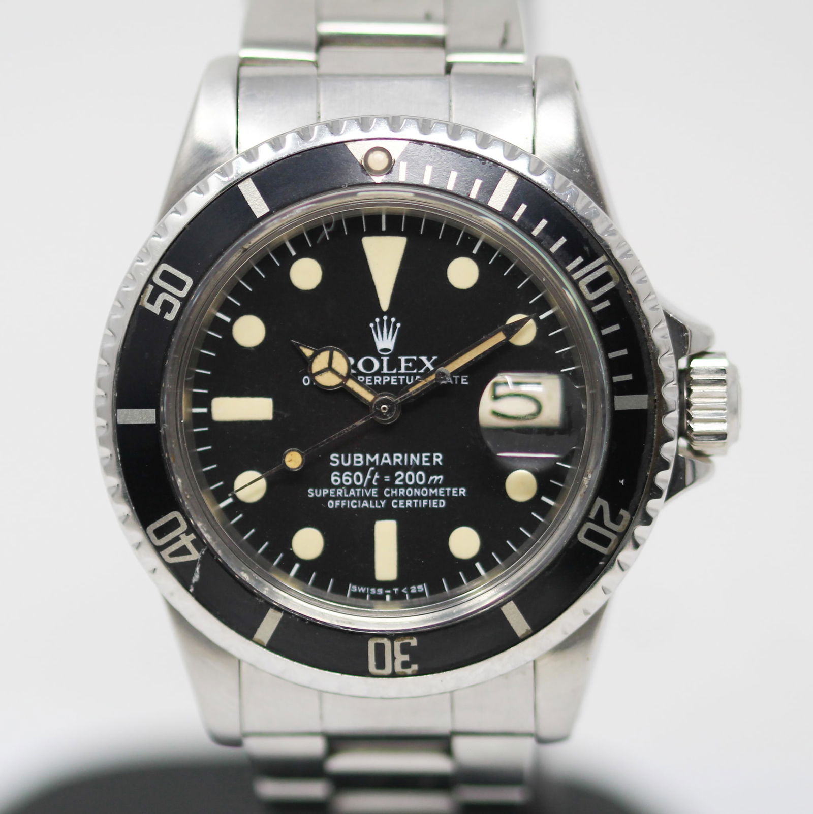 Vintage Rolex Oyster Perpetual Date Submariner Wristwatch: Stainless Steel Vintage Rolex Oyster Perpetual Date Submariner Wristwatch on Stainless Steel Rolex Bracelet; Model 1680, Serial # 5572416. 40mm diameter. Running at time of cataloging. PLEASE NOTE: al
