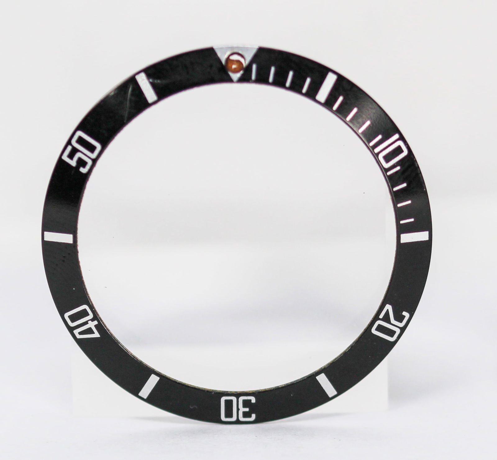 Loose Vintage Rolex Submariner Bezel: Loose Vintage Rolex Submariner Bezel. Black bezel. 38mm diameter. Loose watch parts. PLEASE NOTE: all wristwatches are sold "as-is", with no mechanical warranty or guarantee. Any representation as to