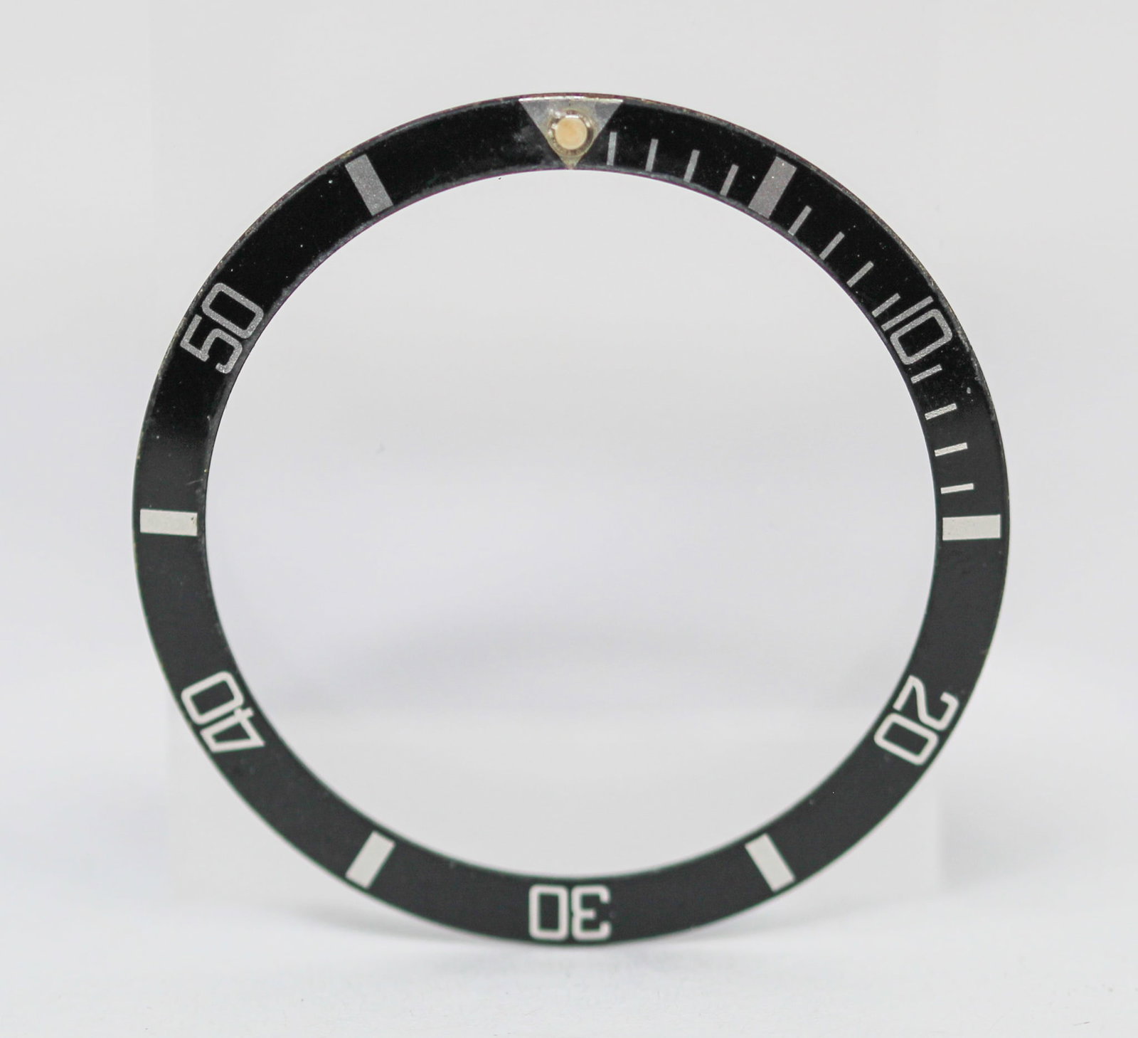 Loose Vintage Rolex Submariner Bezel: Loose Vintage Rolex Submariner Bezel. Black bezel. 37mm diameter. Loose watch parts. PLEASE NOTE: all wristwatches are sold "as-is", with no mechanical warranty or guarantee. Any representation as to