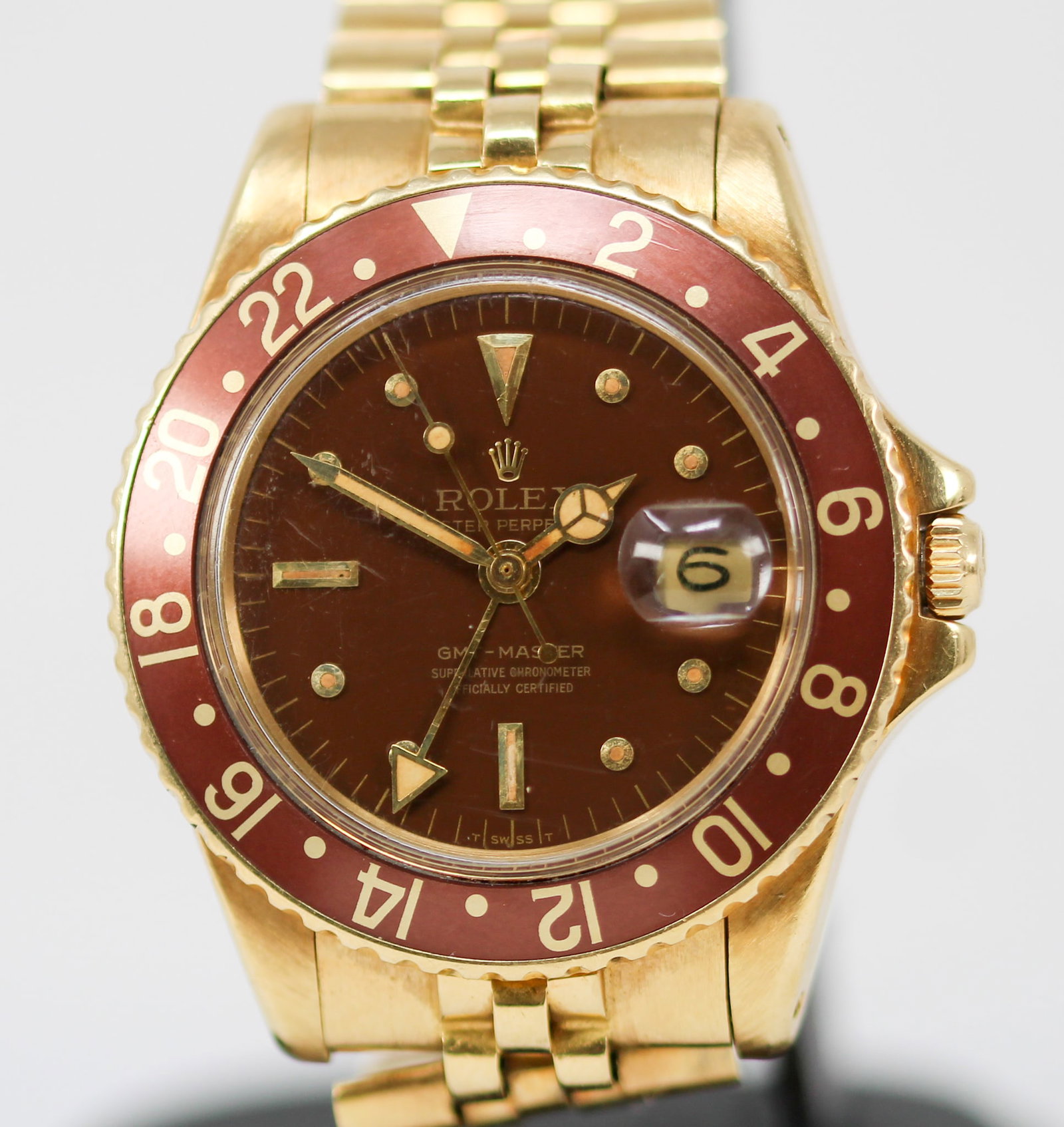 Vintage Rolex Oyster Perpetual GMT-Master with Date Wristwatch in 18k Yellow Gold: 18k Yellow Gold Vintage Rolex Oyster Perpetual GMT-Master with Date Wristwatch on 18k Yellow Gold Rolex Bracelet; Model 1675, Serial # 1906271. Total weight: 128g. 40mm diameter. Running at time of ca