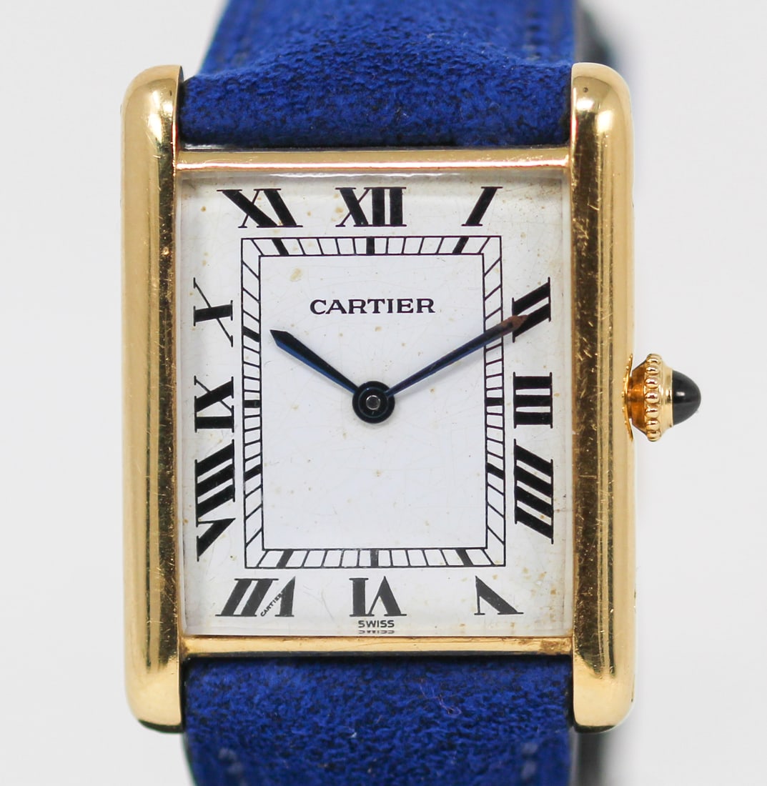 Vintage Cartier Rectangular Wristwatch in 18k Yellow Gold: 18k Yellow Gold Vintage Cartier Rectangular Wristwatch on Aftermarket Leather Strap; Ref 17011, Serial # 0677. 26mm x 33mm. Running at time of cataloging. PLEASE NOTE: all wristwatches are sold "as-is