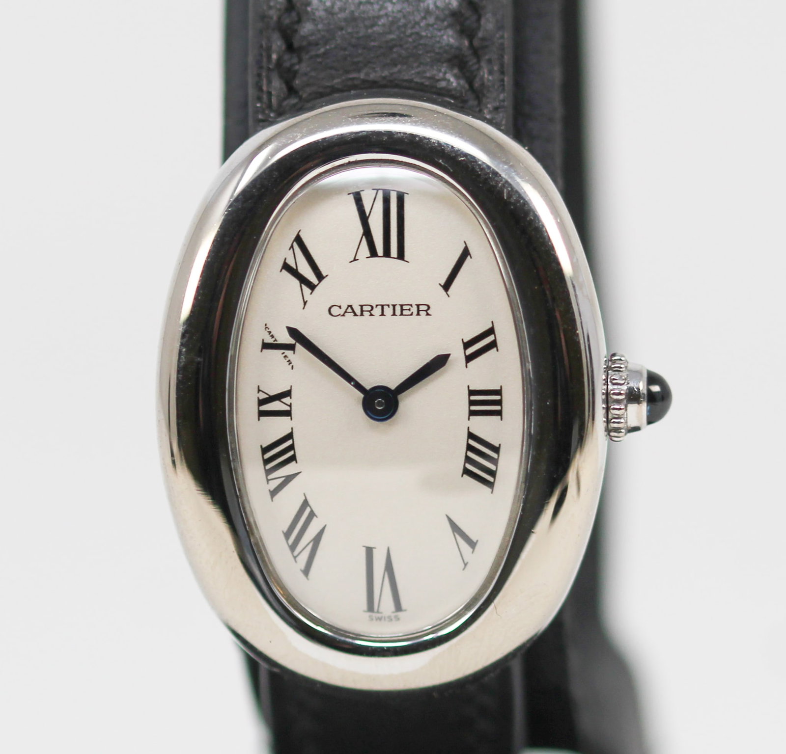 Vintage Cartier Baignore Wristwatch in 18kt White Gold: 18kt White Gold Vintage Cartier Baignore Wristwatch on Leather and 18kt White Gold Cartier Strap; Ref 1955, Serial # 535313CD. 22mm diameter. Running at time of cataloging. PLEASE NOTE: all wristwatch