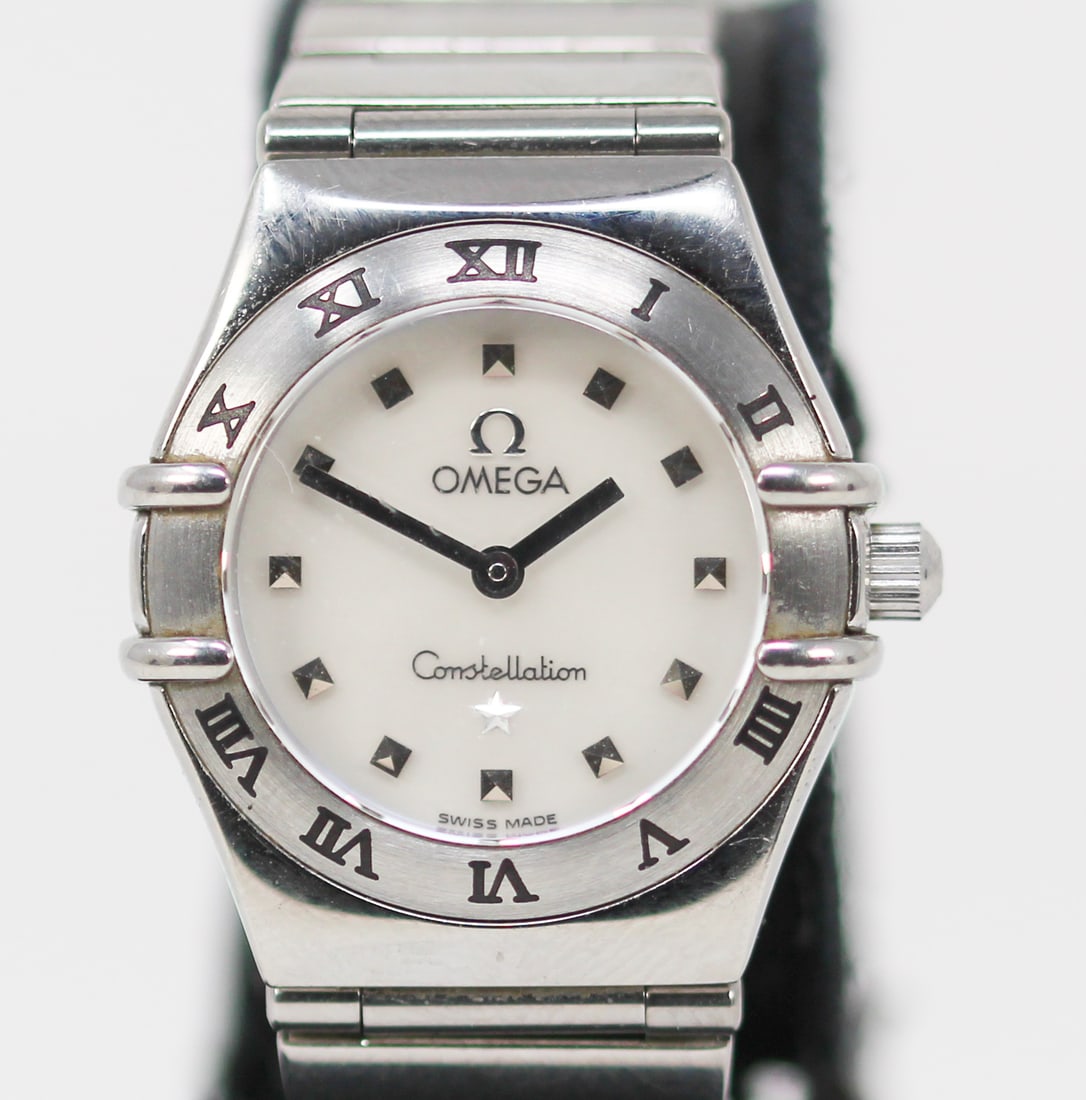 Ladies Omega Constellation Wristwatch: Stainless Steel Ladies Omega Constellation Wristwatch on Stainless Steel Omega Bracelet; Serial # 58954697. 23mm diameter. Not running. PLEASE NOTE: all wristwatches are sold "as-is", with no mechanic