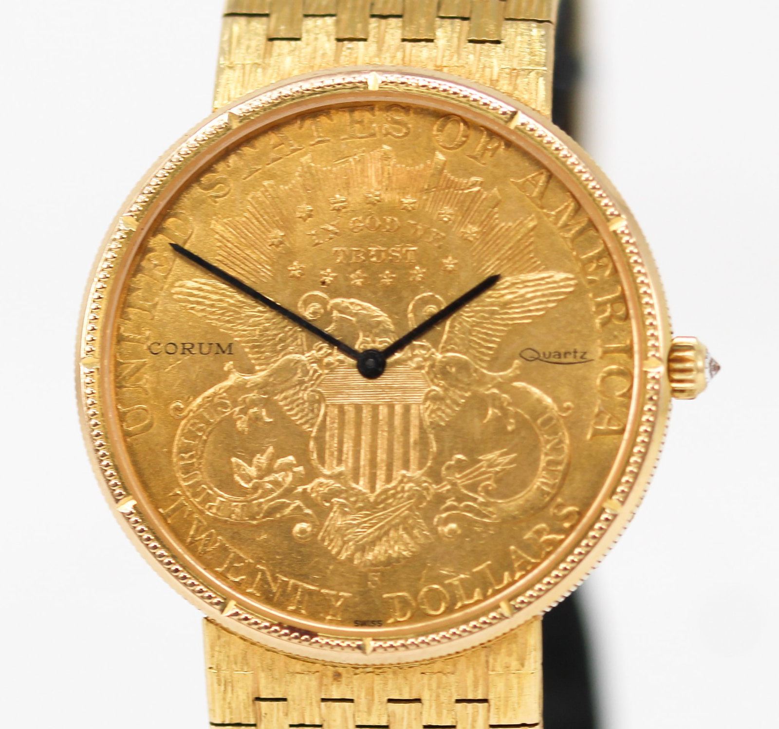 Corum Gold Eagle Coin Wristwatch in 18kt Yellow Gold: 18kt Yellow Gold Corum Gold Eagle Coin Wristwatch on Intergrated 18kt Yellow Gold Corum Bracelet. Total weight: 110g. 35mm diameter. Not running. PLEASE NOTE: all wristwatches are sold "as-is", with n