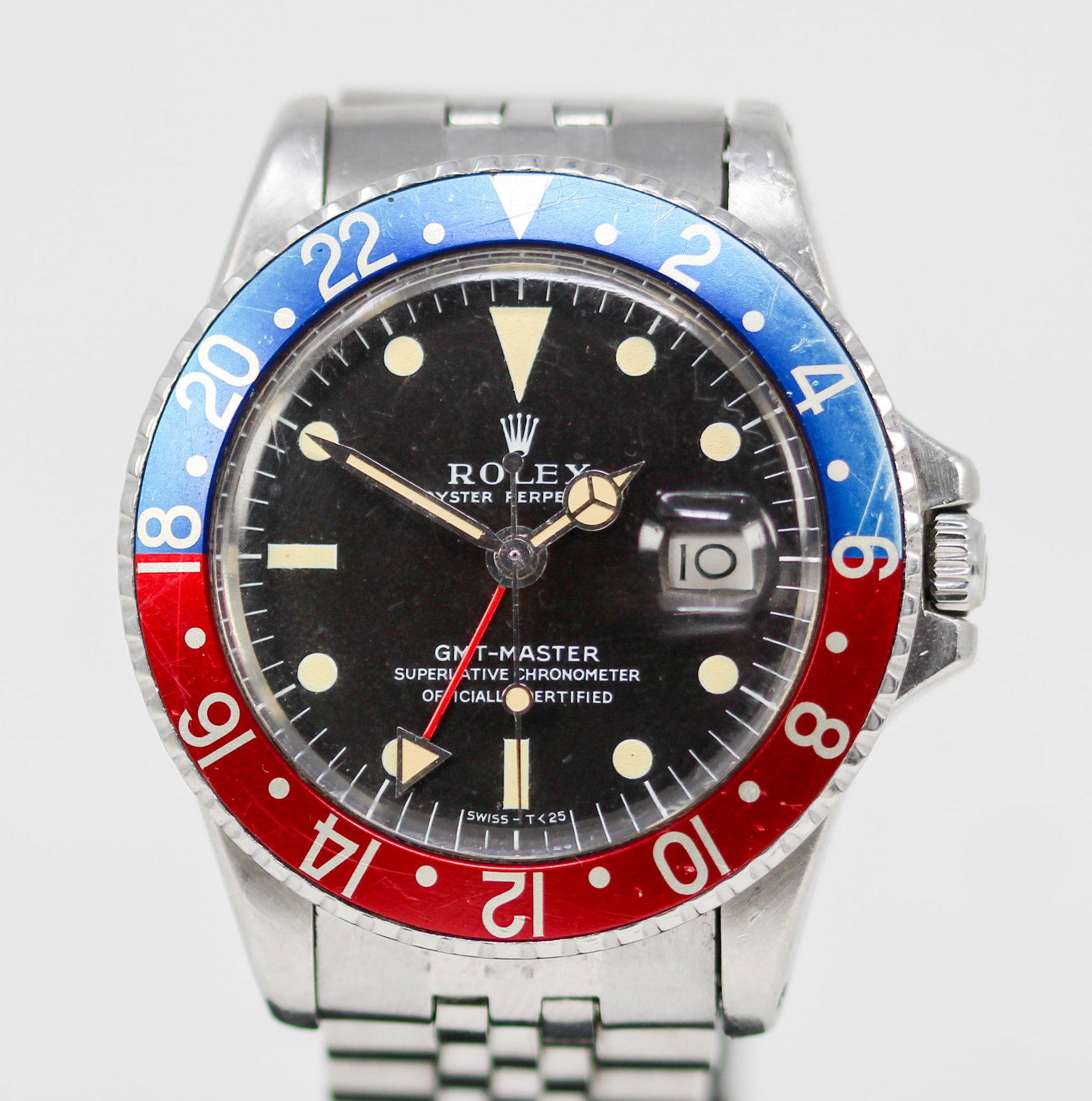 Vintage Rolex Oyster Perpetual GMT-Master with Date Wristwatch: Stainless Steel Vintage Rolex Oyster Perpetual GMT-Master with Date Wristwatch on Stainless Steel Rolex Bracelet; Model 1675, Serial # 3384945. 40mm diameter. Running at time of cataloging. PLEASE NOT