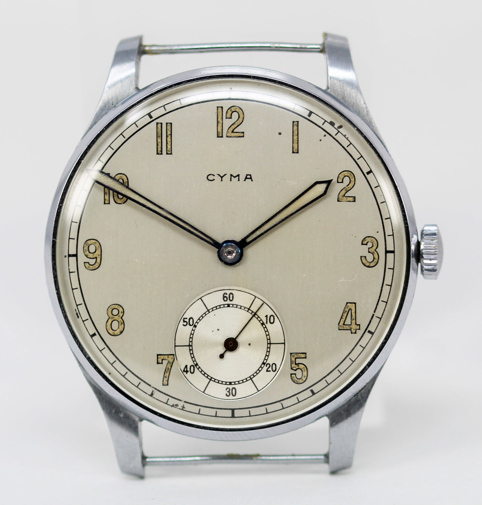 Vintage Cyma Wristwatch with Cyma Hang Tag: Stainless Steel & Chrome Vintage Cyma Wristwatch with Cyma Hang Tag; Serial # 133001. 41mm diameter. Running at time of cataloging. PLEASE NOTE: all wristwatches are sold "as-is", with no mechanical w