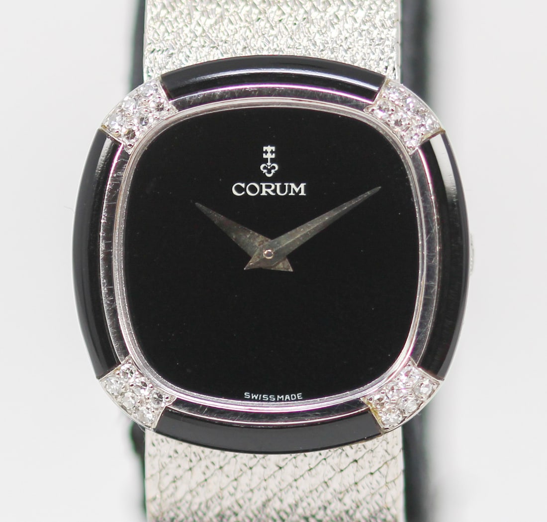 Ladies Corum Wristwatch in 18kt White Gold with Factory Onyx and Diamond Bezel with Corum Box, Corum: 18kt White Gold Ladies Corum Wristwatch on Integrated 18kt White Gold Corum Bracelet with Factory Onyx and Diamond Bezel with Corum Box, Corum Owner's Manual, and Corum Certificate; Ref 27226B47, Seri