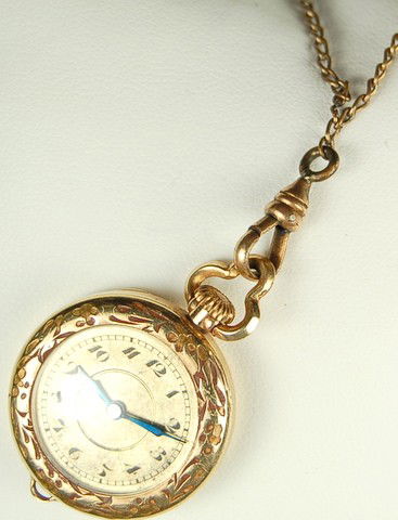 ANTIQUE GOLD PENDANT WATCH BULOVA w CHAIN: This ANTIQUE Pendant Pendant Watch is either GOLD or GOLD Filled. It was made by BULOVA W. CO. and it measures 1 inch across. The front of the watch has a beautiful face with Black Numbers against a G
