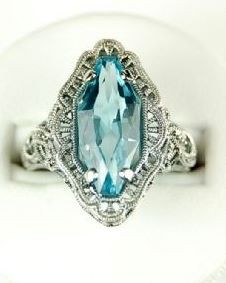 ANTIQUE STERLING SILVER RING BLUE TOPAZ 7 CTS: This 'Vintage Style' ring is solid Sterling Silver. It exquisitely and authentically reproduces the filigree work made popular in the 1930's. It features a gorgeous (and impressive) Blue Topaz = 7 Car