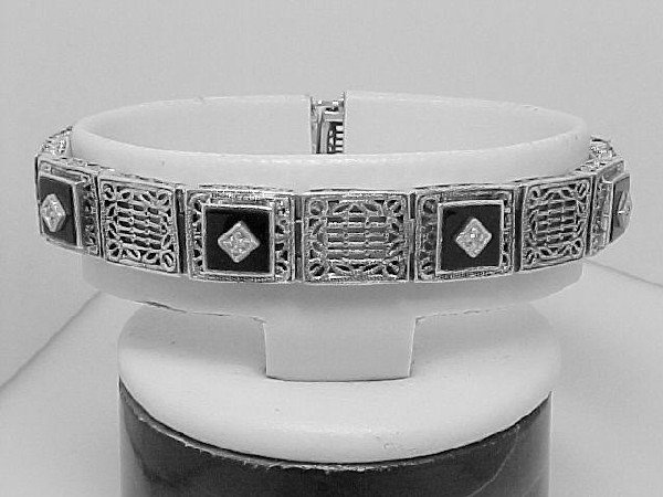 ANTIQUE STERLING SILVER BRACELET DIAMOND ONYX: This Antique Style Bracelet is an Authentic and Accurate copy of a Bracelet from the 1930s and THIS one is in MINT condition. The Bracelet is STERLING SILVER and it features exquisite Filigree Links w