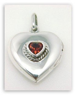STERLING SILVER LOCKET HEART PENDANT: This beautiful Heart shaped LOCKET Pendant is High Quality SOLID STERLING SILVER and it features a Heart shaped GARNET colored stone in the center. The Locket measures approximately 3/4 inch x 1 inch 