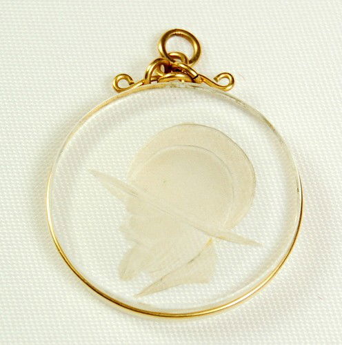 ANTIQUE 14K GOLD PENDANT INTAGLIO KNIGHT GLASS: This ANTIQUE Pendant features an Intaglio of a Knight in profile etched into either glass or crystal. The Pendant is beautifully framed in 14k Gold, and there is a 14k Gold circle atop to accommodate