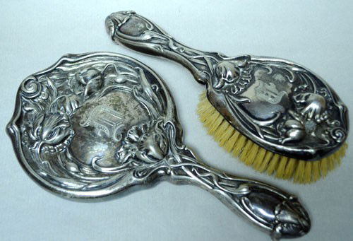 ANTIQUE ART NOUVEAU HAIR BRUSH MIRROR SILVER PLATE: This Antique Art Nouveau Hand Mirror and Hair Brush set is Circa 1900. The Set is SILVER Plate and exhibits magnificent design typical of the Art Nouveau period. The set is approximately 9 1/2 inches