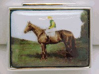 STERLING SILVER PILLBOX JOCKEY ON HORSE PILL BOX: THIS VERY HANDSOME PILLBOX WOULD BE AN APPROPRIATE AND THOUGHTFUL GIFT FOR SOMEONE WHO LIKES HORSES. This Pillbox is all Sterling Silver. It is rectangular and it measures 1 1/2" x 1" with a very fine