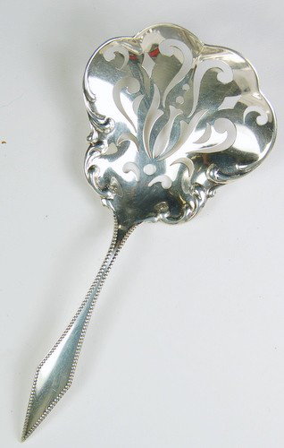 STERLING SILVER NUT SPOON R. WALLACE & SONS: This STERLING SILVER NUT SPOON is by 'R. Wallace & Sons'. It is 5 3/4 inches in length and it weighs 22 GRAMS.