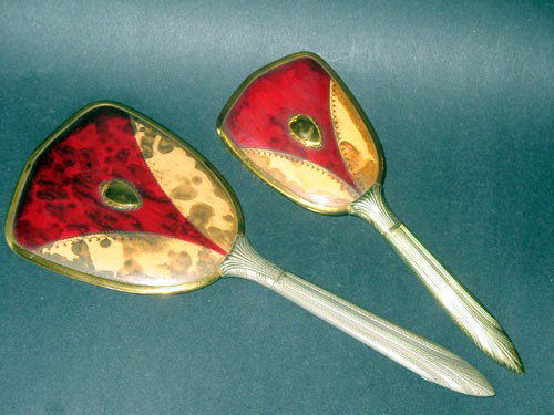 ANTIQUE VANITY SET MIRROR AND MATCHING BRUSH: This Antique VANITY SET is Circa 1930 and it features a handled mirror and a handled brush. The Brush is approximately 10 inches in length and it is 3 3/4 inches at the widest. The Mirror is 13 inches