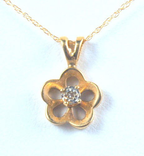 14K GOLD PENDANT DIAMOND FLOWER GOLD CHAIN: This 14k GOLD Pendant is Flower shaped and set with a center DIAMOND. The Diamond Flower pendant is suspended from a 14k GOLD Chain 16 inch Necklace.