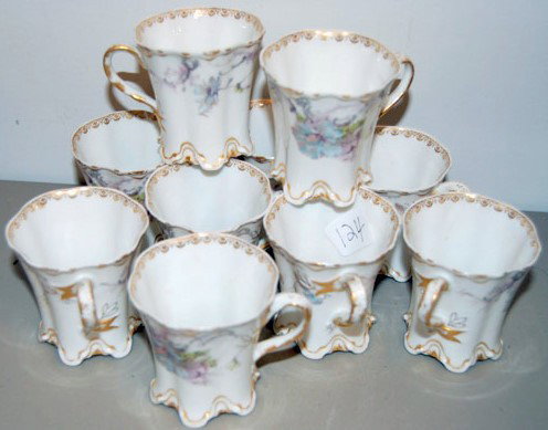 10 ANTIQUE CHOCOLATE CUPS HAVILAND & CO LIMOGES : This is a set of 10 ANTIQUE CHOCOLATE CUPS by HAVILAND & CO LIMOGES FRANCE. Each cup is 2 1/2 inches tall and measures about 2 1/2 inches across the top of the cup. The floral design is acceted by GOL