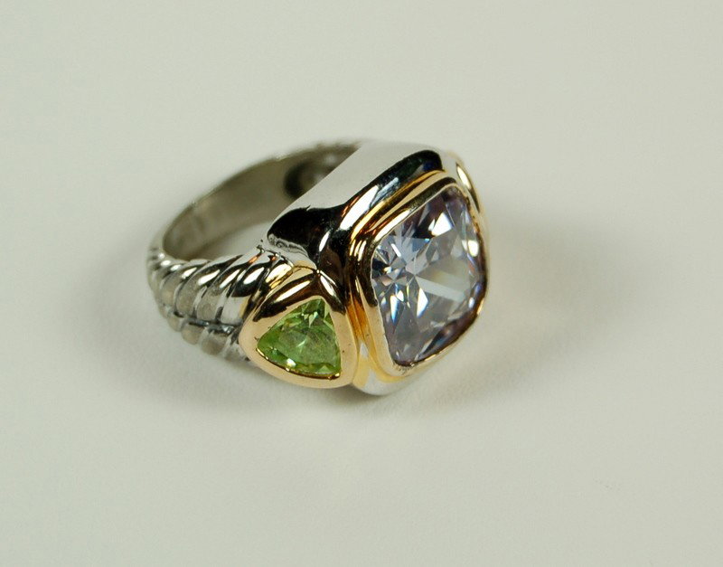 STERLING SILVER RING AMETHYST CZ AND PERIDOT CZ: This STERLING SILVER ring features a AMETHYST CZ with a PERIDOT CZ each side. This ring is a Size 6 and can be resized. (this ring looks like - but is not David Yurman!)