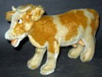 VINTAGE STEIFF COW BUTTON IN EAR: This Vintage stuffed animal is a COW and it was made by STEIFF with a button in the ear. This adorable cow is 10 inches in length.