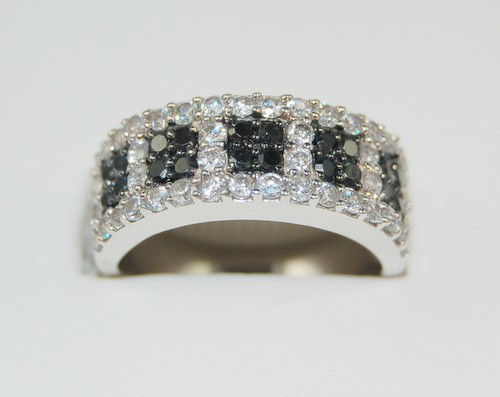 STERLING SILVER WEDDING BAND RING BLACK WHITE CZ: This SOLID STERLING SILVER Ring features individual handset Black and Clear 'CZ'. Absolutely looks like a Black and White Diamond Wedding Band. It is available in a size 6, 7 and 8.