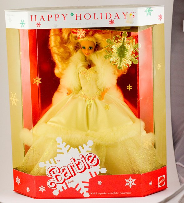 1989 HAPPY HOLIDAYS BARBIE DOLL SPECIAL EDITION MATTEL: This is a MATTEL SPECIAL EDITION 1989 HAPPY HOLIDAYS BARBIE DOLL that has NEVER BEEN REMOVED FROM THE BOX! Barbie is wearing a beautiful White Tulle Gown with faux fur trim - and - she also has a faux