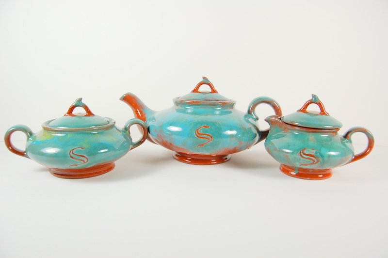 ART POTTERY SET TEAPOT SUGAR CREAMER BY HICK 1950: This is a VINTAGE three piece Art Pottery set consisting of a Ceramic Teapot, covered Sugar Bowl, and Covered Creamer. These 3 Glazed Ceramic pieces are done in Blue-Green and Brown, and each has an '