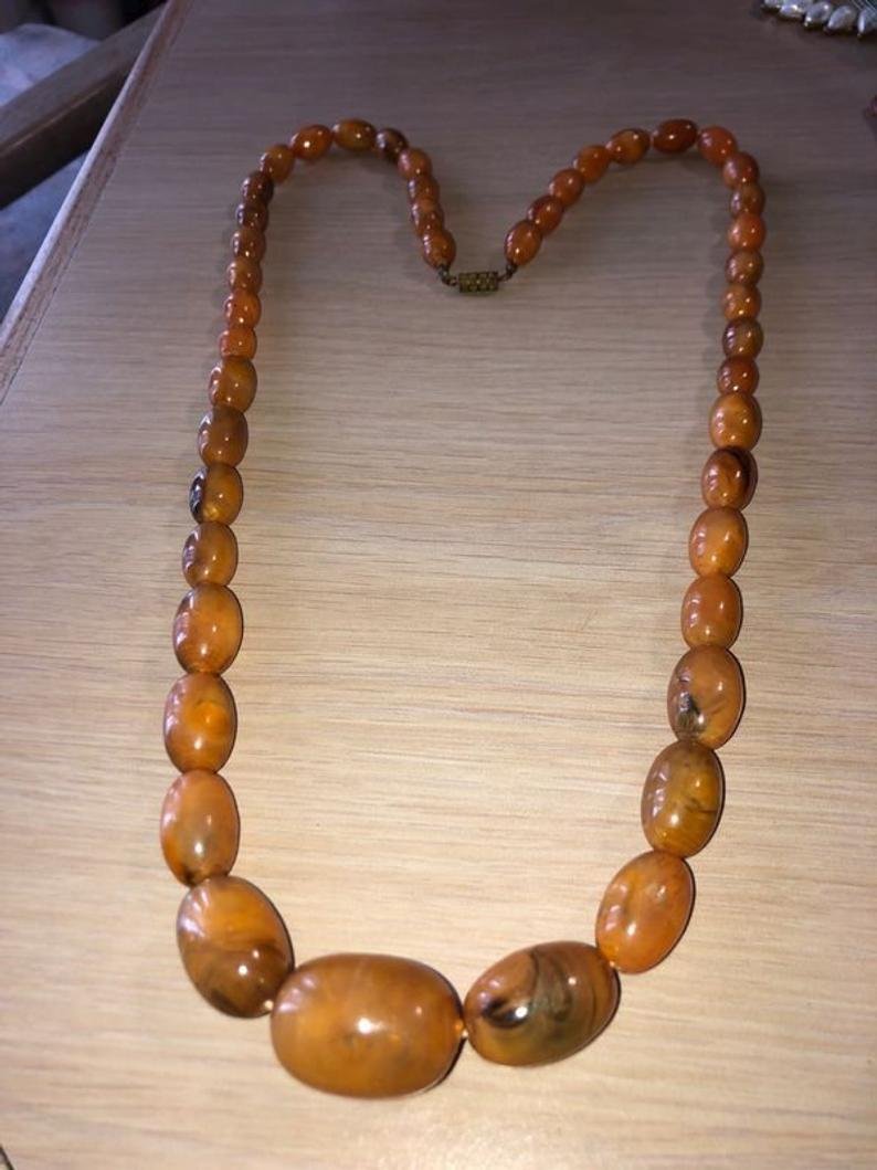 Vintage Baltic Amber Graduated 30” Necklace 60-Grams TW: Vintage Baltic Amber Graduated 30” Necklace 60-Grams TW Preowned. Static Tested. No Reserve Bid & No Buyers Premium. In House Shipping Priority Mail Standard Flat Rate.