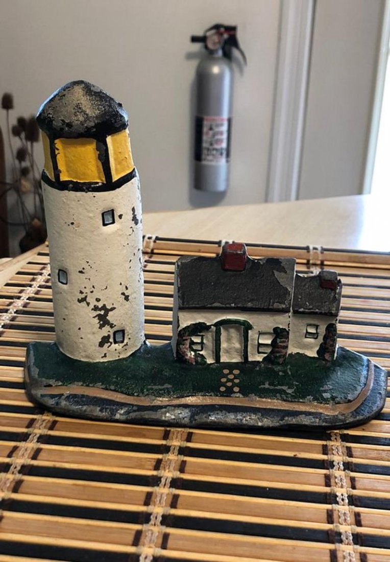 Lighthouse Cast Iron 7”Wide Door Stop Preowned: Lighthouse Cast Iron 7”Wide Door Stop Preowned From an Estate. No Reserve Bid & No Buyers Premium. Local Pickup or Shipping by the UPS Store only.