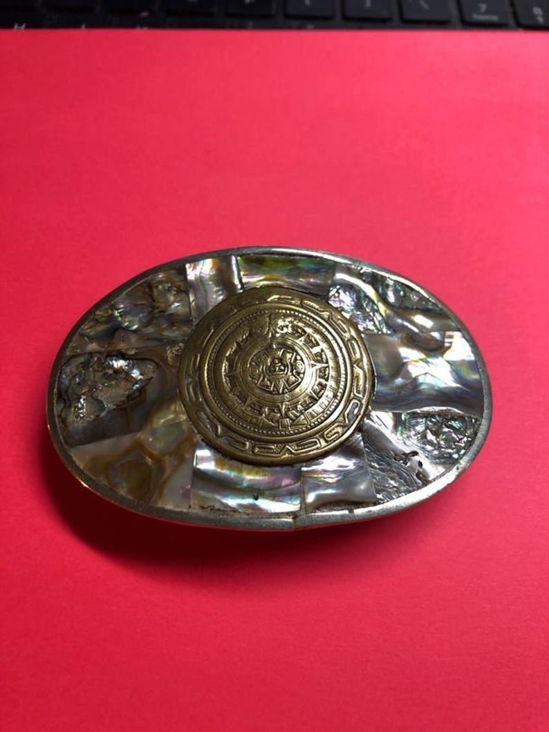 Vintage Mexican Belt Buckle Silver Tone Color Metal..: Vintage Mexican Belt Buckle Silver Tone Color Metal with Abalone Mother of Pearl 3-1/2” x 2-1/4” Preowned from an Estate. No Reserve Bid & No Buyers Premium. Shipping $5.00