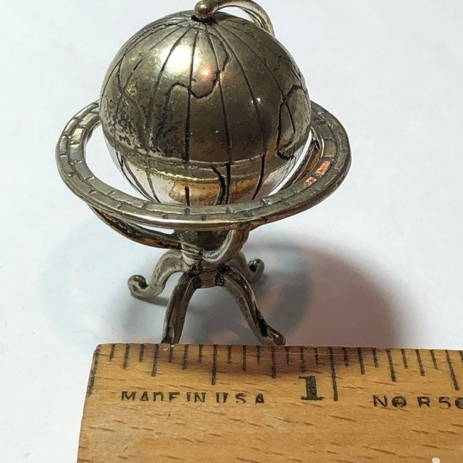 Vintage Sterling Silver Swivel Globe Weighs 24.5 Grams: Vintage Sterling Silver Swivel Trinket Globe Weighs 24.5 Grams TW in VG Condition. $4.00 Domestic Shipping.