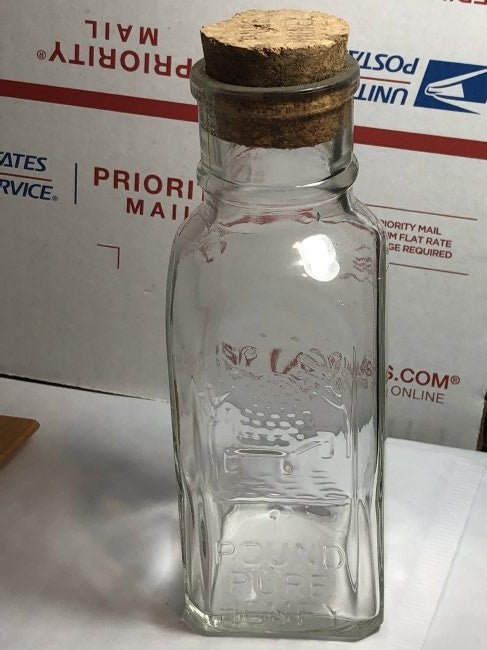 VINTAGE HONEY ACRES 1 POUND PURE HONEY BOTTLE EMBOSSED: VINTAGE HONEY ACRES 1 POUND PURE HONEY BOTTLE EMBOSSED WITH BEEHIVE BOTTLE IN VG CONDITION. $10 DOMESTIC SHIPPING.
