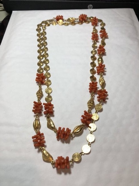 Vtg 52" Trifari Necklace Faux Coral Clusters w/Goldtone: Vintage 52" Trifari Necklace Faux Coral Clusters w/Gold Tone Shells & Faux Coins Crowned T Charm in VG Preowned Condition. $5.00 Domestic Shipping.