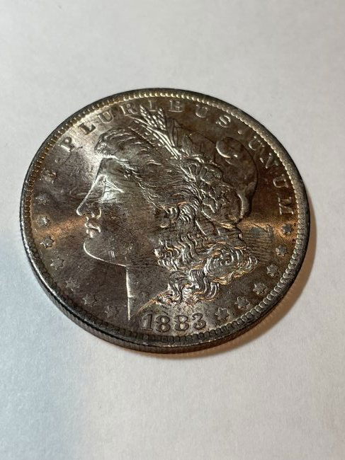 1883-O UNCIRCULATED LIGHTLY TONED CONDITION MORGAN $1 (1 of 2)