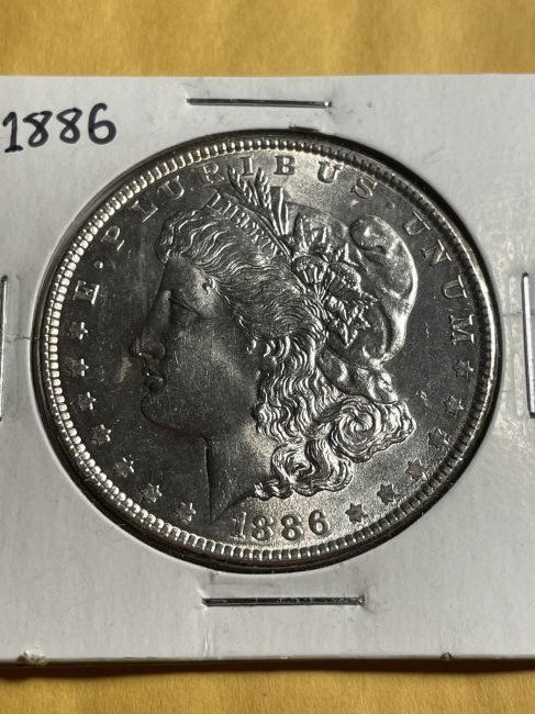 1886-P BU CONDITION MORGAN SILVER DOLLAR AS PICTURED. (1 of 2)