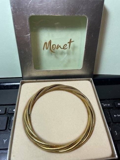Vtg MONET Never Used Fashion Gold-tone Cable Bangle Bracelet in VG Preowned Condition: Vintage MONET Never Used Fashion Gold-tone Cable Bangle Bracelet in VG Preowned Condition. FREE Domestic Shipping.