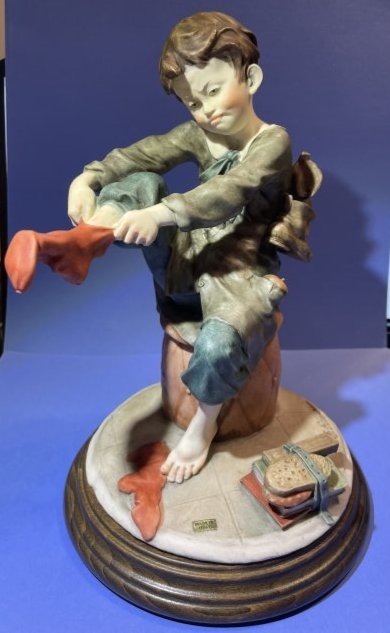 Vtg Giuseppe Armani "Boy putting on his Socks" Alabaster Capodimonte Figurine 9.5" Tall: Vintage Collectible Giuseppe Armani "Boy putting on his Socks" Alabaster Capodimonte Figurine 9.5" Tall in VG Condition. $15 Domestic Shipping.