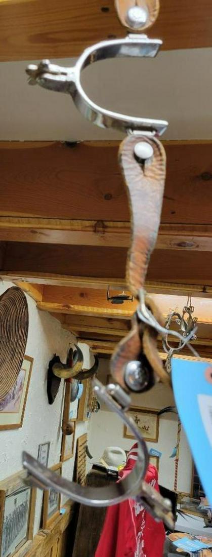 Pair of Silver color spurs with leather straps (1 of 2)