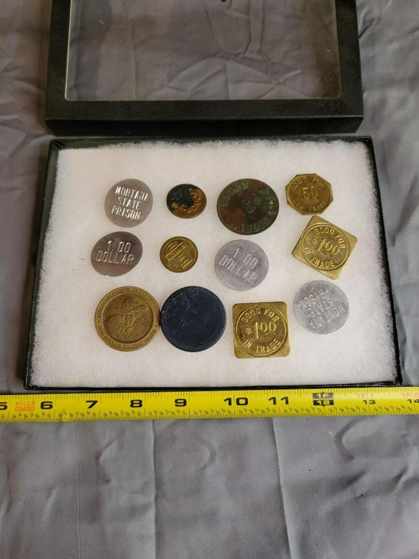 Small display frame with 11 assorted trade tokens (1 of 17)