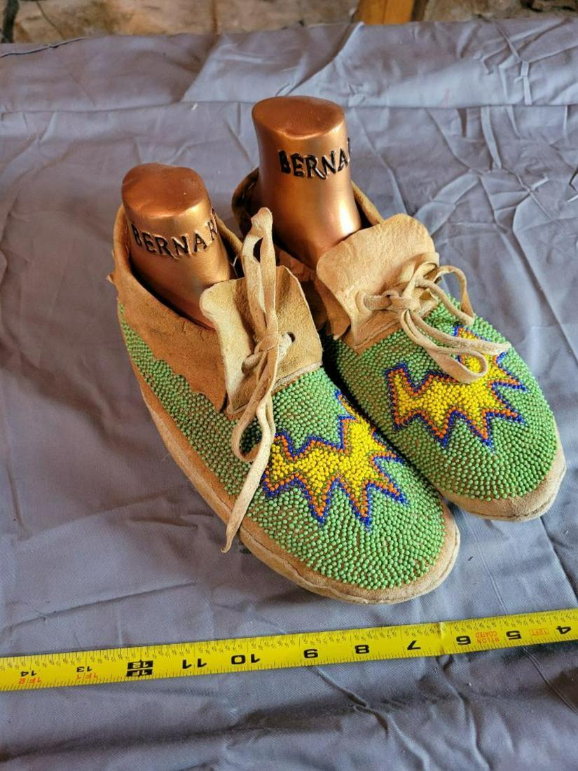 Pair of highly decorated moccasin's with shoe forms (1 of 5)