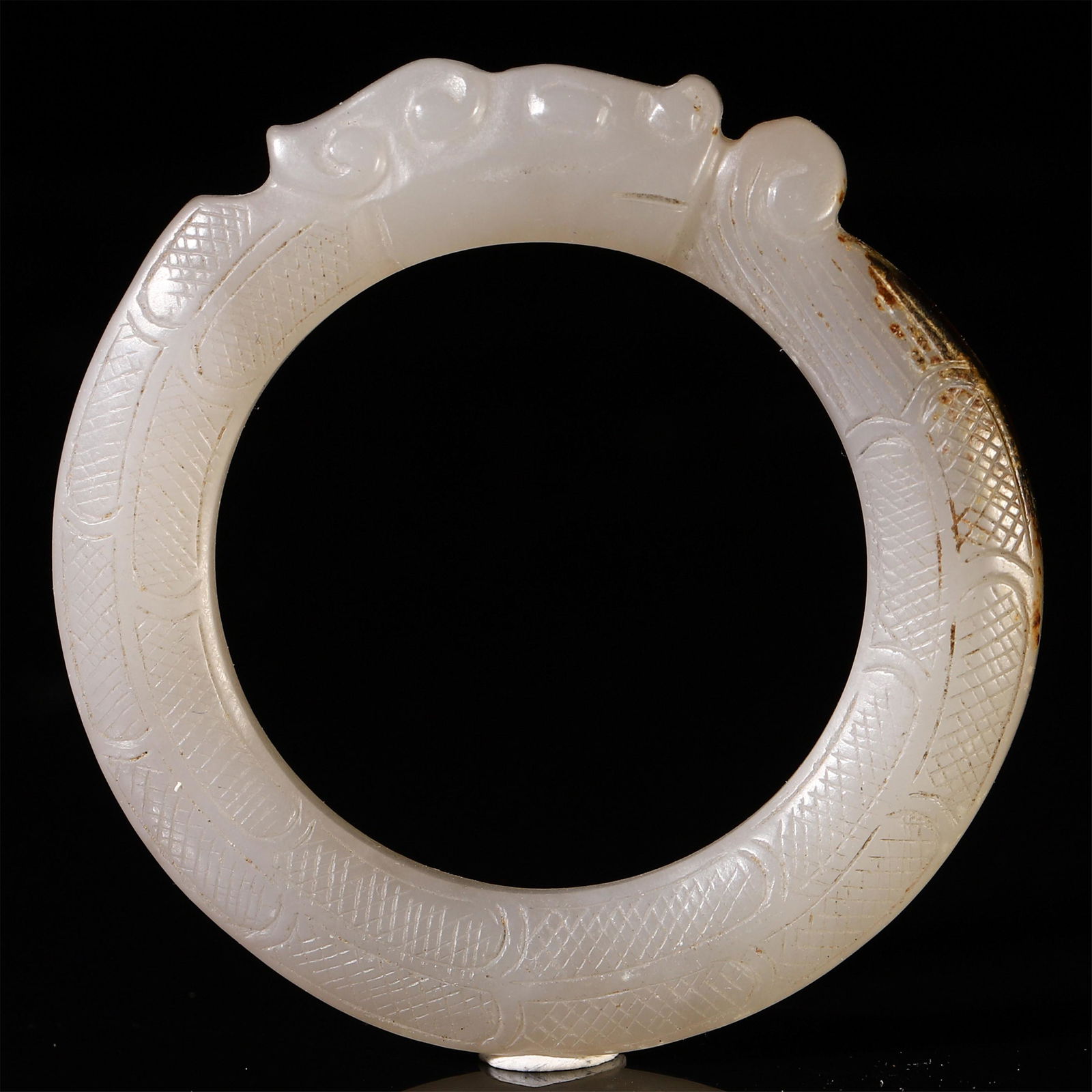 A CHINESE WHITE JADE CARVED BANGLE (1 of 6)