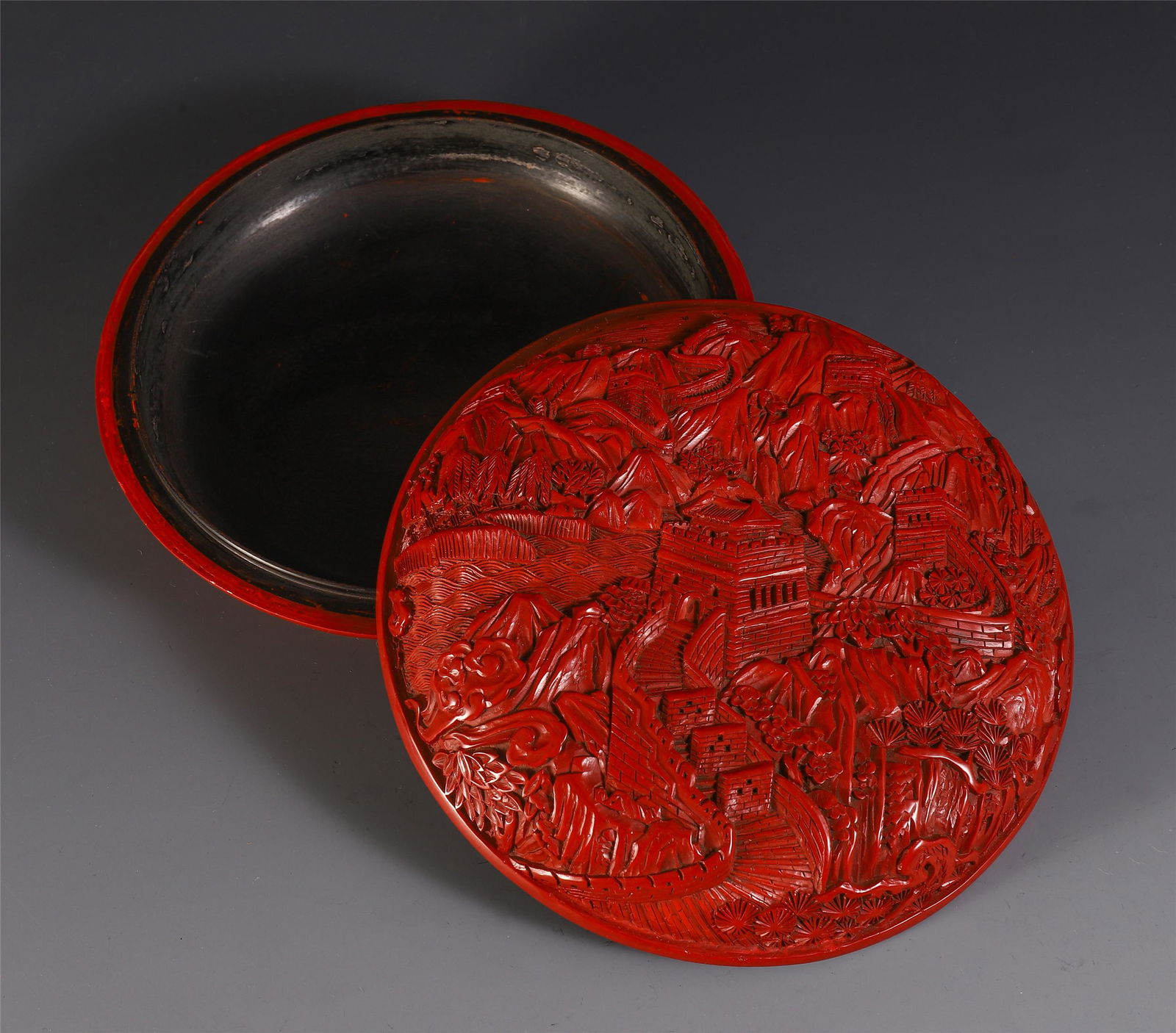 A CHINESE CINNABAR CARVED LANDSCAPE MOTIF LIDDED BOX (1 of 8)