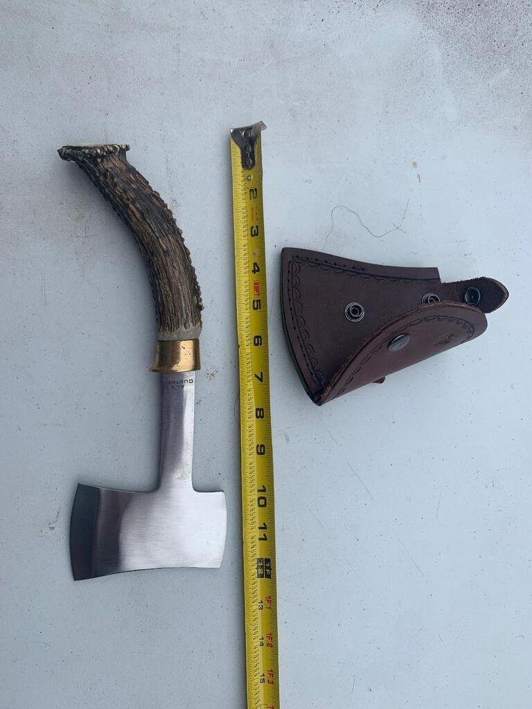 Antler Handle Hatchet: 62.101 Brand new Hand made stag handled hatchet by Al's Customs About 12 inches overall length. Handmade leather sheath