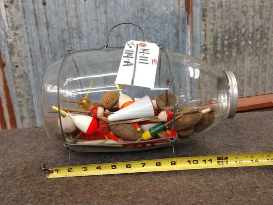 Vintage C.F. Orvis Glass Minnow Trap: 14.111 manufactured in Manchester Vermont with wire legs and holder filled with antique fishing bobbers neat package