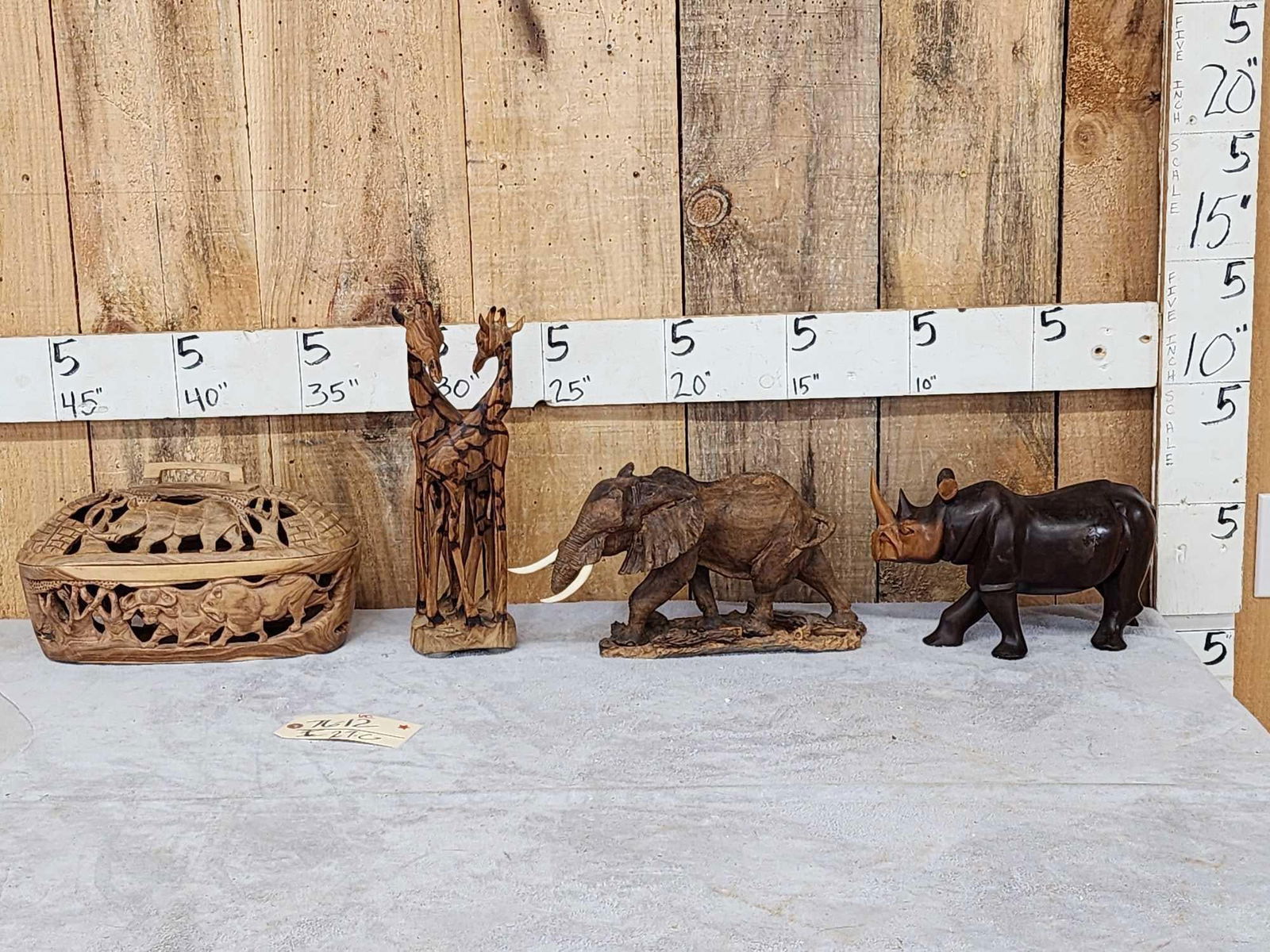Group Of African Hand Carved Figurines: 76.12 Includes Ironwood Rhinoceros Elephant with bone tusks Giraffe wooden basket featuring Africa's big 5 authentic pieces brought home from Safari