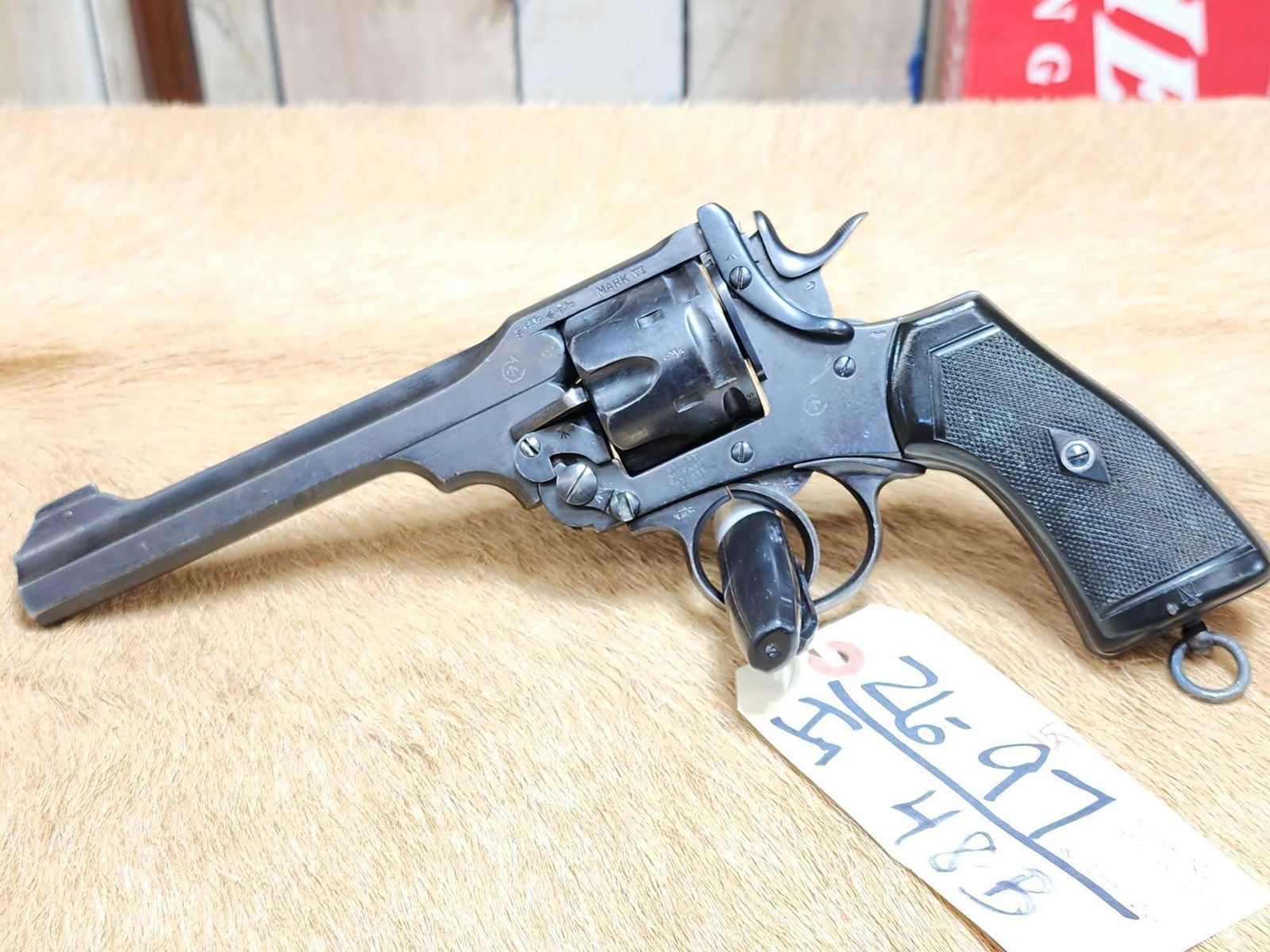 Webley Mark VI .455 Webley Revolver: 26.97 Good condition for its age shiny bore good rifling action seems crisp locks up fairly tight matching serial numbers SN 233706