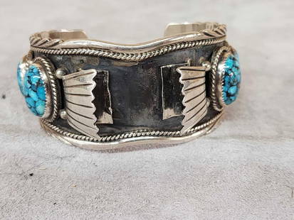 Native American Style Sterling Silver Watch Holder Bracelet Cuff: 73.16 Fine detailed tooling with Turquoise The prominent hallmark is a stylized "T Jon" within a circle, identifying the artisan as Tillie Jon, a Navajo Native American