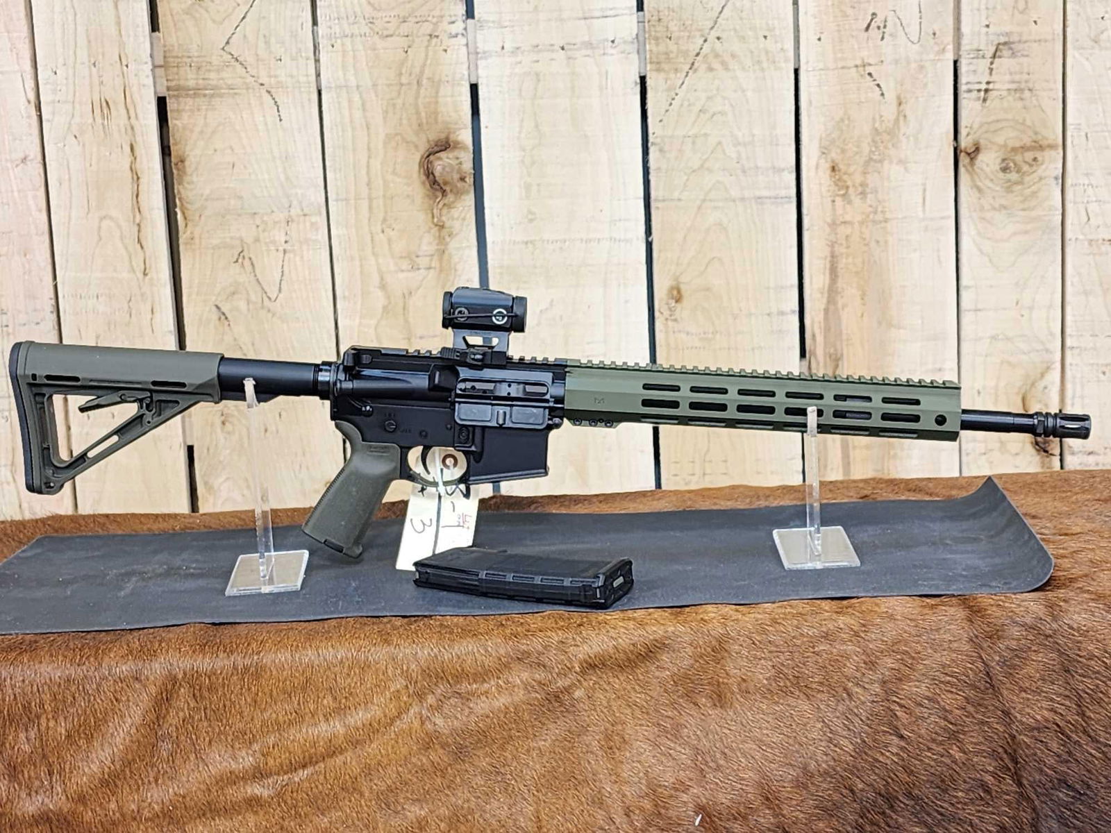 Palmetto State Armory Model PA15 5.56 Semi Auto Rifle: 8.1 Appears to have seen little use Magpul furniture Crimson Trace optics SN SCNL236310